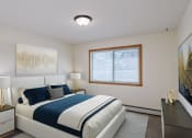 Thumbnail 4 of 15 - a bedroom with a white bed and a blue and white comforter. Fargo, ND Windsor Apartments