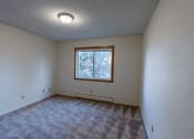 Thumbnail 10 of 17 - a bedroom of an empty house with a window
