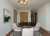 Thumbnail 6 of 11 - a dining room with a table and chairs. Moorhead, MN Woodstone Apartments