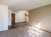 Thumbnail 5 of 13 - an empty living room with a tile floor and white walls. Fargo, ND Brookfield Apartments