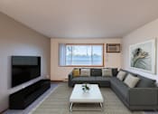 Thumbnail 1 of 33 - a living room with a gray couch and a coffee table and a television. Fargo, ND Brownstone Apartments