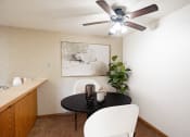Thumbnail 2 of 15 - a dining room with a table and chairs and a ceiling fan . Fargo, ND Cedar Pointe Apartments