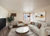 Thumbnail 1 of 15 - a living room with couches and a table. Fargo, ND Cedar Pointe Apartments