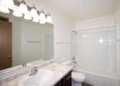Thumbnail 39 of 42 - a bathroom with a sink and a shower and a toilet. Fargo, ND Country Club Apartments