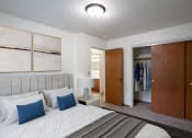 Thumbnail 4 of 18 - a bedroom with a bed and a closet.Fargo, ND Crown Court 1 Apartments