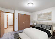 Thumbnail 3 of 23 - a bedroom with a bed and a closet and a door to a bathroom. Fargo, ND Flagstone Apartments