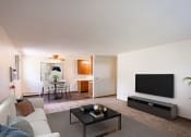 Thumbnail 1 of 20 - a living room with a couch and a coffee table. Fargo, ND Martha Alice Apartments