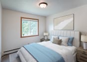 Thumbnail 2 of 15 - a bedroom with a bed and a window. Fargo ND Morningside Apartments