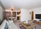 Thumbnail 2 of 28 - a living room with a couch and a coffee table. Fargo, ND Pacific Park 2 Apartments