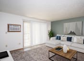 Thumbnail 1 of 28 - a living room with a white couch and a coffee table. Fargo, ND Pacific Park 2 Apartments