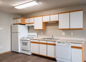 Thumbnail 13 of 16 - a kitchen with white appliances and white cabinets and a white refrigerator