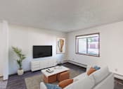 Thumbnail 5 of 19 - a living room with a white couch and a tv. Fargo, ND Rosegate Apartments
