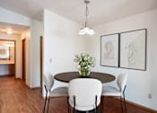Thumbnail 3 of 19 - a dining room with a table and chairs. Fargo, ND Rosegate Apartments