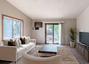Thumbnail 1 of 19 - a living room with a couch and a coffee table and a tv. Fargo, ND Rosegate Apartments