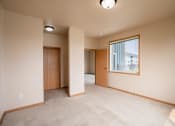 Thumbnail 53 of 61 - a bedroom with a large window. West Fargo, ND West Lake Apartments 11A