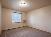 Thumbnail 35 of 61 - a bedroom with a window. Fargo, ND West Lake Apartments