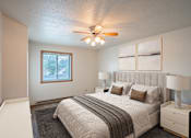 Thumbnail 8 of 25 - the master bedroom has a large bed and a ceiling fan. Fargo, ND Westview Towers Apartments