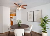 Thumbnail 2 of 25 - a dining room with a table and chairs and a ceiling fan. Fargo, ND Westview Towers Apartments
