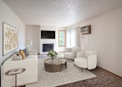 Thumbnail 1 of 25 - a living room with white furniture and a fireplace.Fargo, ND Westview Towers Apartments