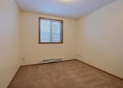 Thumbnail 11 of 25 - an empty room with carpet and a window at France, Fargo, ND 58103