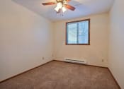 Thumbnail 13 of 25 - an empty room with a ceiling fan and a window at France, Fargo, ND