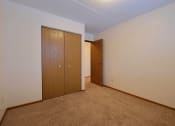 Thumbnail 14 of 25 - a bedroom with a closet and a door to a hallway at France, Fargo, 58103