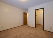 Thumbnail 10 of 25 - a bedroom with a door to a closet and a carpeted floor at France, Fargo