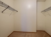 Thumbnail 16 of 25 - a room with two hanging racks on the wall and a closet at France, Fargo, 58103