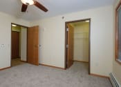 Thumbnail 15 of 21 - a bedroom with a walk in closet. Fargo, ND Crossroads Apartments
