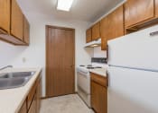Thumbnail 3 of 7 - Mandan, ND Garden Grove Apartments | 2 Bdrm - Kitchen
