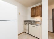 Thumbnail 6 of 7 - Mandan, ND Garden Grove Apartments. A kitchenette