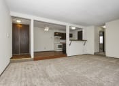 Thumbnail 7 of 32 - Fridley, MN Georgetown Apartments. A living room with a couch and a chair