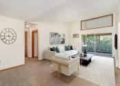 Thumbnail 1 of 19 - a furnished living room with high vaulted ceilings. Golden Valley, MN Valley View Apartments