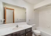 Thumbnail 16 of 19 - a bathroom with a bathtub, toilet, and sink.  Golden Valley, MN Valley View Apartments.