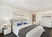 Thumbnail 4 of 19 - a bedroom with a large bed and two windows. Golden Valley, MN Valley View Apartments