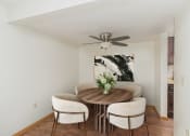 Thumbnail 5 of 19 - a dining room with a table with four chairs around it.  Golden Valley, MN Valley View Apartments