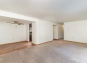 Thumbnail 10 of 19 - an empty living room with white walls and a ceiling fan.  Golden Valley, MN Valley View Apartments