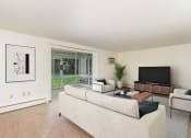 Thumbnail 3 of 19 - a living room with a couch and a tv.  Golden Valley, MN Valley View Apartments