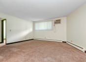 Thumbnail 9 of 11 - White Bear Lake, MN White Bear Terrace Apartments.  a bedroom with a carpeted floor and a window