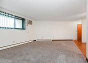 Thumbnail 5 of 11 - White Bear Lake, MN White Bear Terrace Apartments.  a living room with a carpeted floor and a large window
