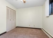 Thumbnail 10 of 11 - White Bear Lake, MN White Bear Terrace Apartments.  a bedroom with white walls and carpet