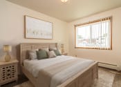 Thumbnail 3 of 11 - a bedroom with a large bed and windows  at Amberwood Court, North Dakota, 58201