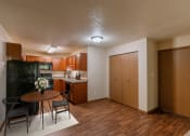 Thumbnail 5 of 16 - the view of a living room and kitchen with a table and chairs