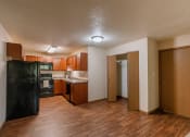 Thumbnail 11 of 16 - Grand Forks, ND Autumn Apartments. The entry to an apartment unit with a dining room, kitchen, and closet.