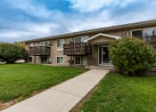 Thumbnail 1 of 16 - Grand Forks, ND Autumn Apartments. The exterior of a two level apartment building.