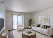 Thumbnail 2 of 16 - a living room with a couch and a coffee table. Grand Forks, ND Autumn Ridge Apartments