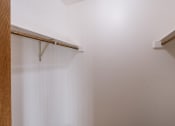 Thumbnail 13 of 14 - an empty closet with white walls. Grand Forks, ND Cedarwood Apartments