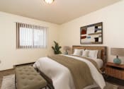Thumbnail 6 of 7 - our apartments offer a bedroom with a king sized bed. Grand Forks, ND Chandler 1898 Apartments
