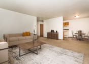 Thumbnail 6 of 10 - Grand Forks, ND Columbia West Apartments a living room with a couch and a coffee table