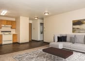Thumbnail 3 of 10 - Grand Forks, ND Columbia West Apartments. a living room with a couch and a coffee table